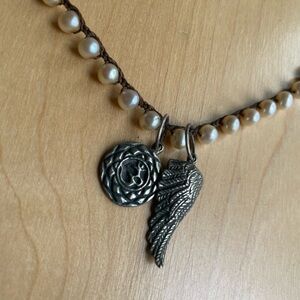 Love heals pearl necklace with charms